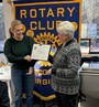 Amber Northern receiving her Paul Harris Fellow certificate and pin from Club President Vicky Rappold.